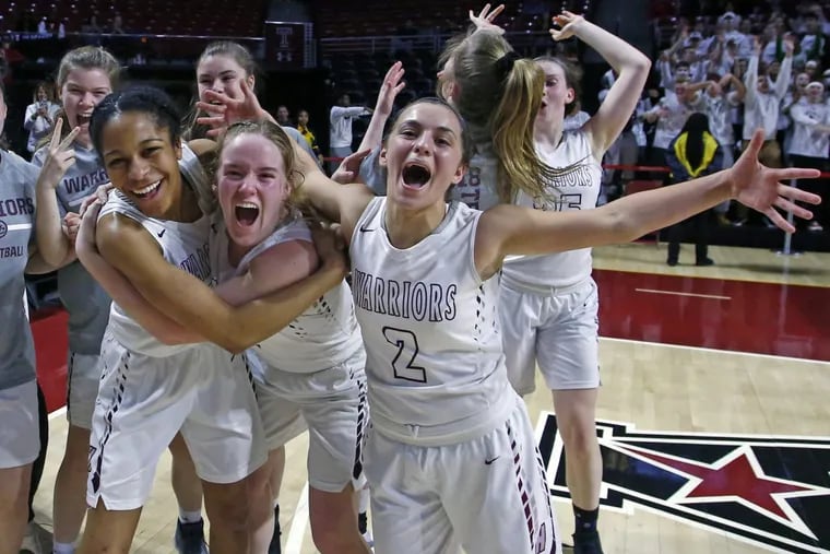 West Chester Henderson players, including (from left) Adrienne Smith, Erin Torrance and Maddie DePrisco (2), celebrate after winning the District 1 Class 5A championship with a 41-32 victory over Villa Maria on Saturday, March 3, 2018, at the Liacouras Center at Temple.