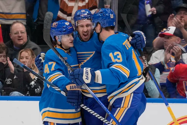 Kevin Hayes (center) celebrating a goal for the St. Louis Blues with Torey Krug (47) and Alexey Toropchenko on Dec. 16.