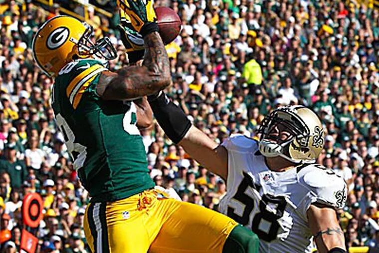 The Packers beat the winless Saints, 28-27, Sunday. (Mike Roemer/AP)