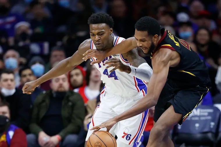 Sixers forward Paul Reed battles for the ball with Cleveland Cavaliers center Evan Mobley in the fourth quarter on Saturday, February 12, 2022 in Philadelphia.
