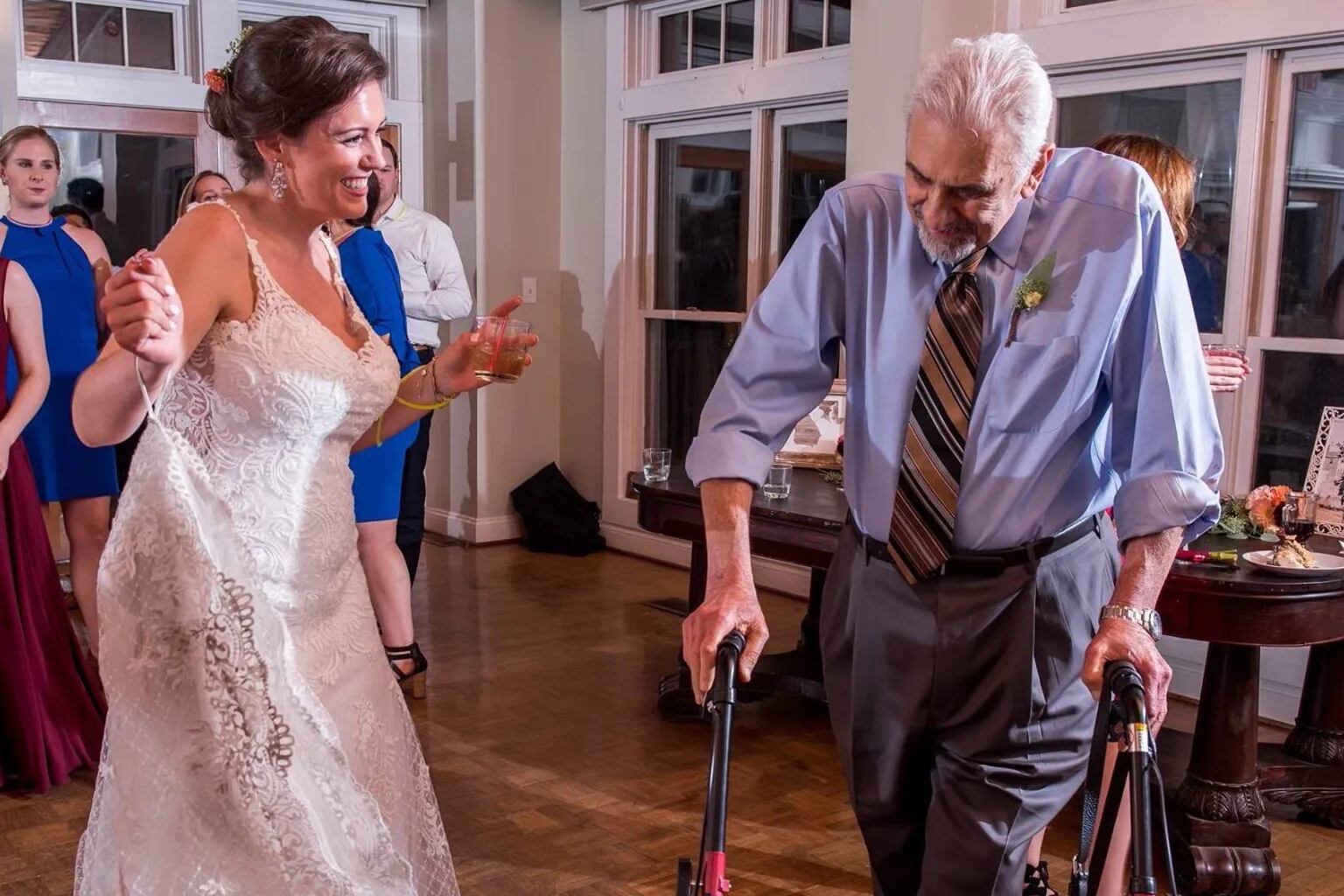 Dr. DeCosmo dances with his granddaughter at her wedding. He always found time for family and friends.