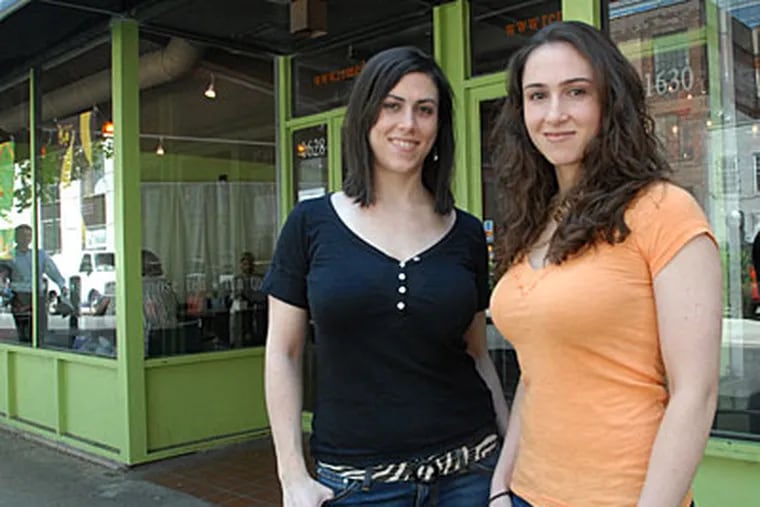 The Kammerer sisters, Courtney (left) and Kristen, at their Remedy Tea Bar. Business is growing, they say, but city regulations frustrate them. (April Saul / Inquirer )