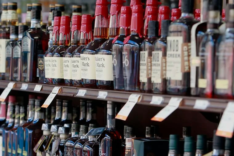 FILE photo shows shelves of alcoholic beverages at a Fine Wine & Good Spirits store.