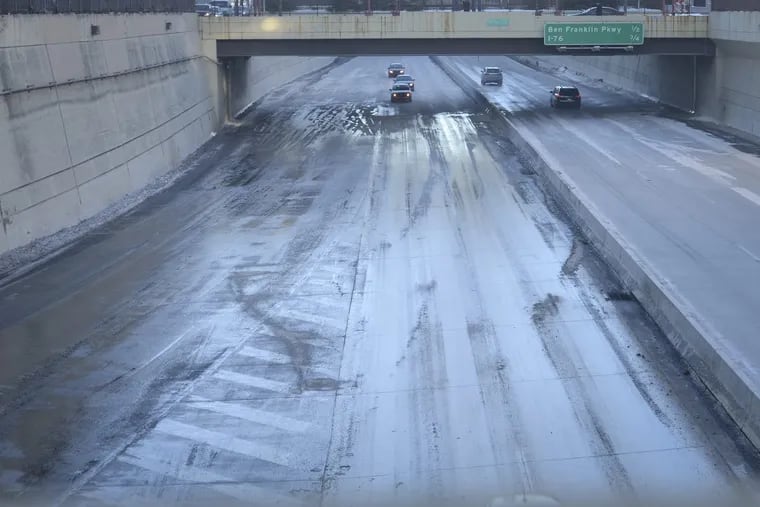 The eastbound side of the Vine Street Expressway in Center City shortly before being reopened Sunday morning. A water main break created icy conditions, forcing the road’s closure for a few hours. JOSE MORENO / Staff Photographer