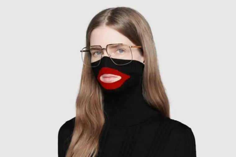 A screenshot taken on Feb.7 from an online fashion outlet showing a Gucci turtleneck black wool balaclava sweater for sale, that they recently pulled from its online and physical stores.