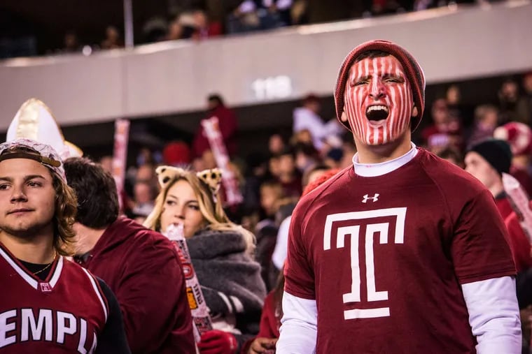 Temple fans cheer their football team at Lincoln Financial Field, where the team will continue to play its home games this season.