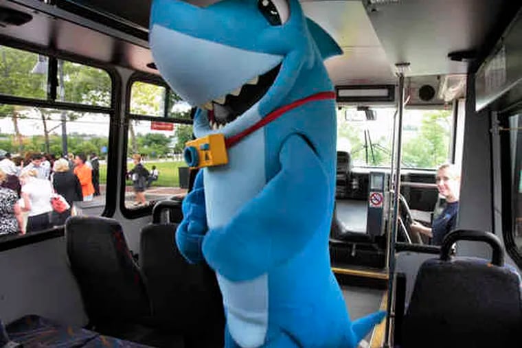 Gill, the Adventure Aquarium mascot, gets ready for a ride on the new &quot;Waterfront Connection&quot; shuttle, which connects Philadelphia's Independence Visitor Center and the Camden riverfront.