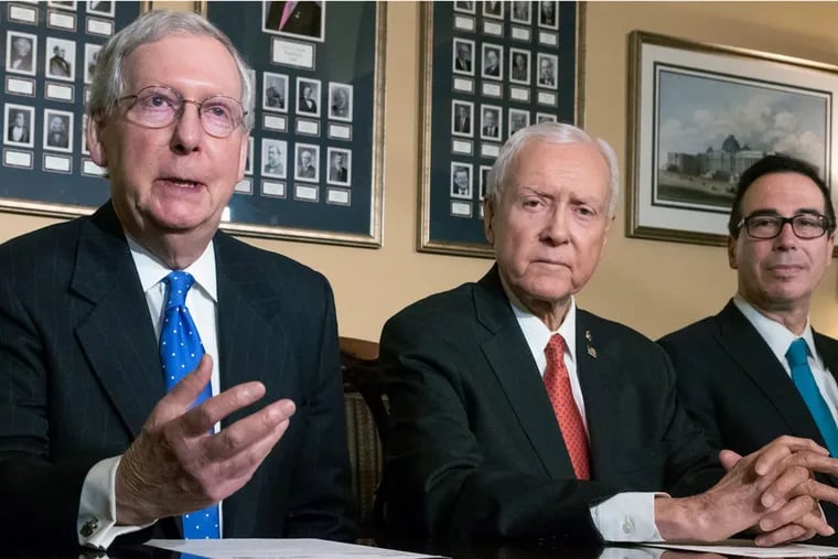Senate Majority Leader Mitch McConnell (from left), Sen. Orrin Hatch (R., Utah), and Treasury Secretary Steve Mnuchin, discuss the Senate’s version of the tax-overhaul bill on Thursday.