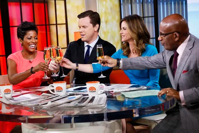 This Monday, Feb. 24, 2014 photo released by NBC shows, from left, Tamron Hall, Willie Geist, Natalie Morales, and Al Roker on the set of NBC's "Today" show. NBC says Hall is joining the third hour of the "Today" show as a co-host. The third hour of NBC's "Today" airs at 9 a.m. Eastern. (AP Photo/NBC, Peter Kramer)