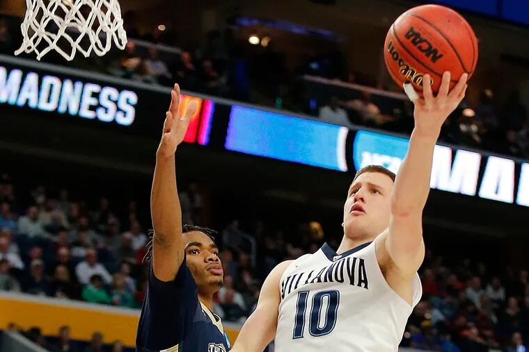 Villanova guard Donte DiVincenzo drives to the basket against Mount St. Mary's forward Chris Wray.