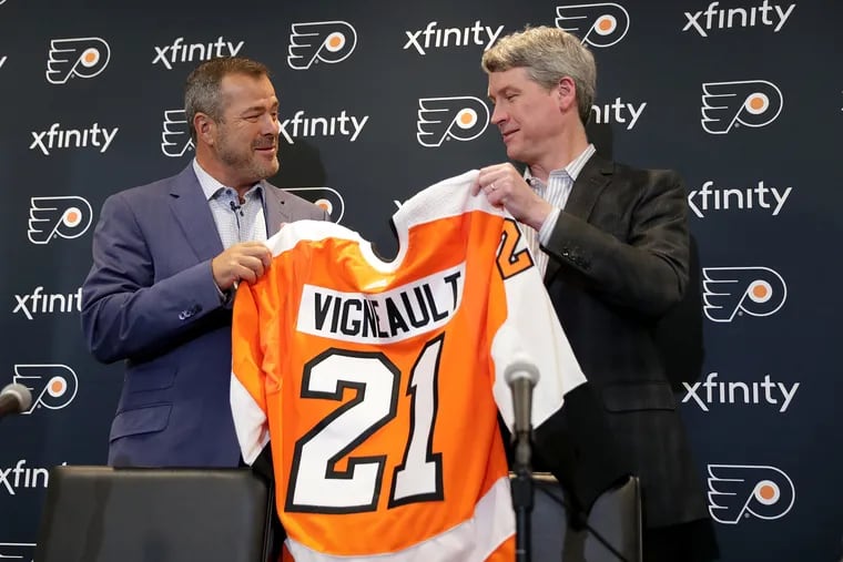 New Flyers head coach Alain Vigneault (left), shown with general manager Chuck Fletcher, will direct Team Canada in the upcoming IIHF World Championship. Two Flyers are on the team.