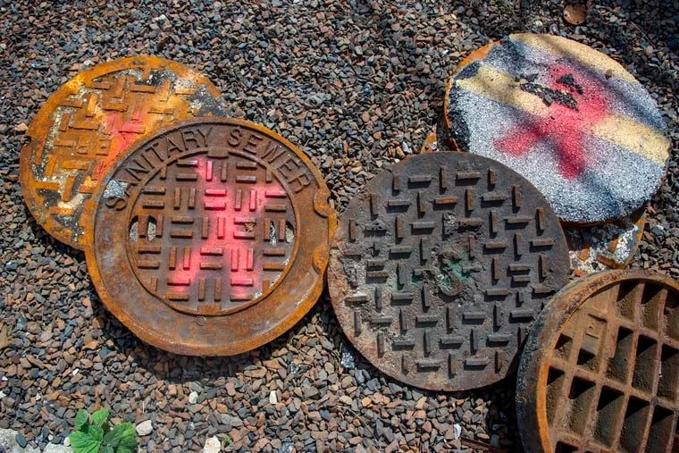 Old and damaged manhole covers.