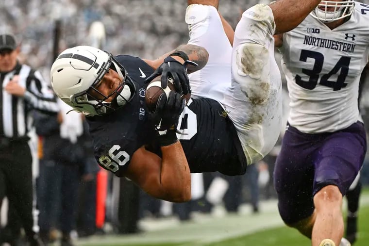 Penn State tight end Brenton Strange dives into the end zone to score a touchdown against Northwestern on Saturday.