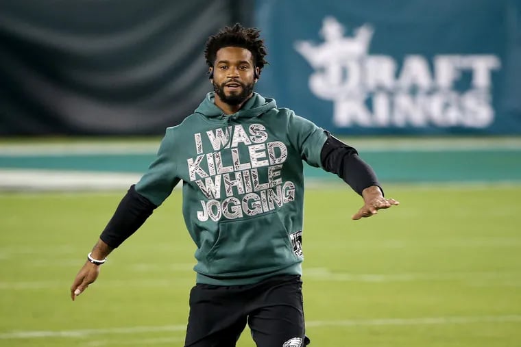 Eagles cornerback Darius Slay wears a hoodie with “I was killed while jogging.” on it as he warms up before the Philadelphia Eagles play the New York Giants at Lincoln Financial Field in Philadelphia, Pa. on October 22, 2020. Slay message was in reference to the killing of Ahmaud Arbery while he was jogging earlier this year.