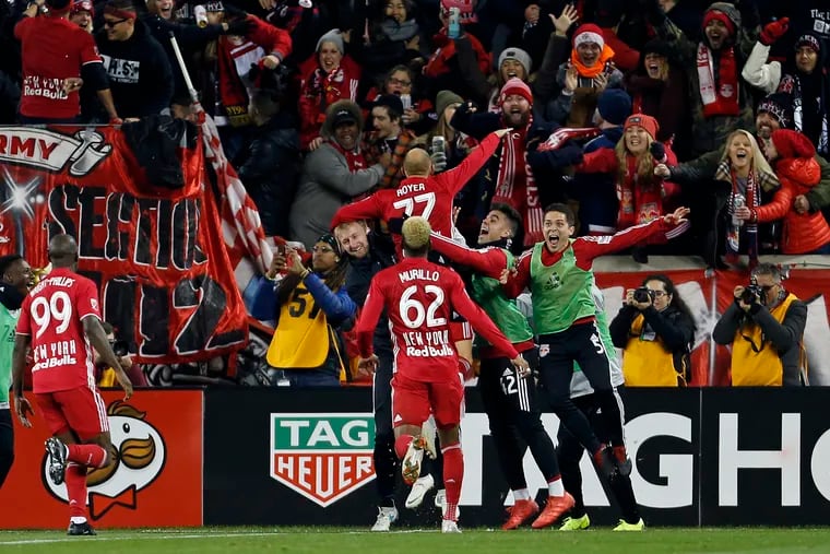New York Red Bulls midfielder Daniel Royer celebrates with teammates after scoring one one of his two goals against the Columbus Crew.
