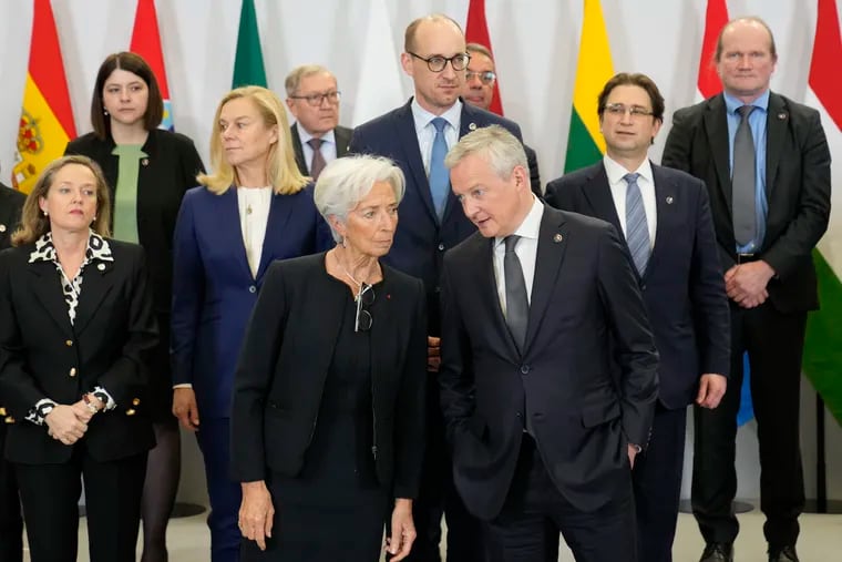 French Economy minister Bruno Le Maire (right) talks with President of European Central Bank Christine Lagarde as they pose for a picture during a European Finance Ministers meeting on Friday.