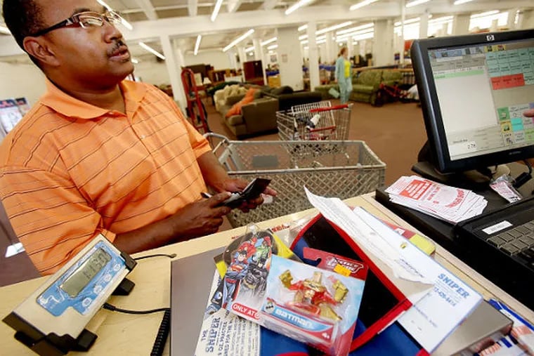 Rodney Lewis takes advantage of a new program at the Salvation Army of selling by the pound in Minneapolis on June 5, 2014. (Joel Koyama /    Minneapolis Star Tribune / MCT)