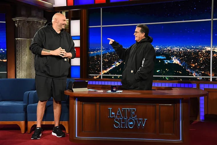 John Fetterman gifts Stephen Colbert his Carhartt hoodie on TV