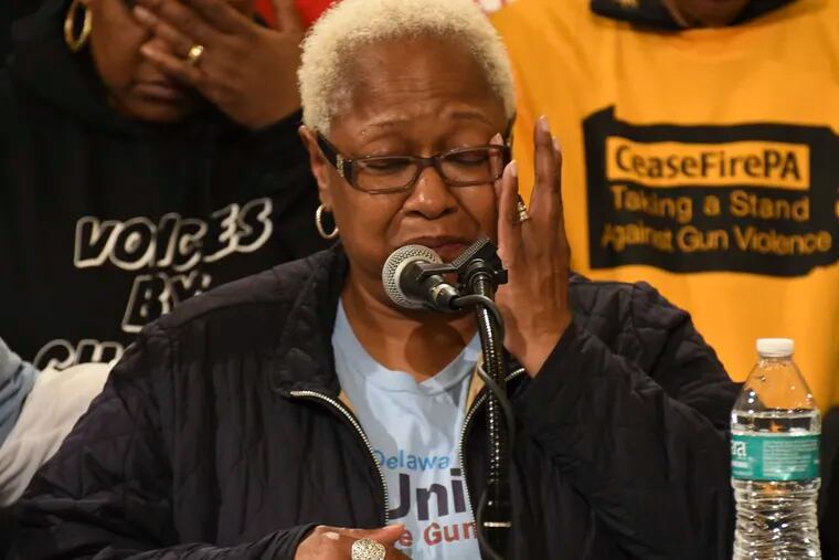 Diana Reynolds, telling of the shooting death of her son, wipes a tear while speaking at a rally in the Pennsylvania Capitol's rotunda calling for lawmakers to take action on anti-gun violence legislation on Tuesday, Jan. 29, 2019 in Harrisburg, Pa. (AP Photo/Marc Levy)