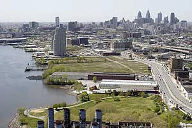 An aerial view of Philadelphia Delaware River waterfront, looking south. Penn Treaty Park is in the foreground. The next empty lot south is the Sugarhouse Casino site.
