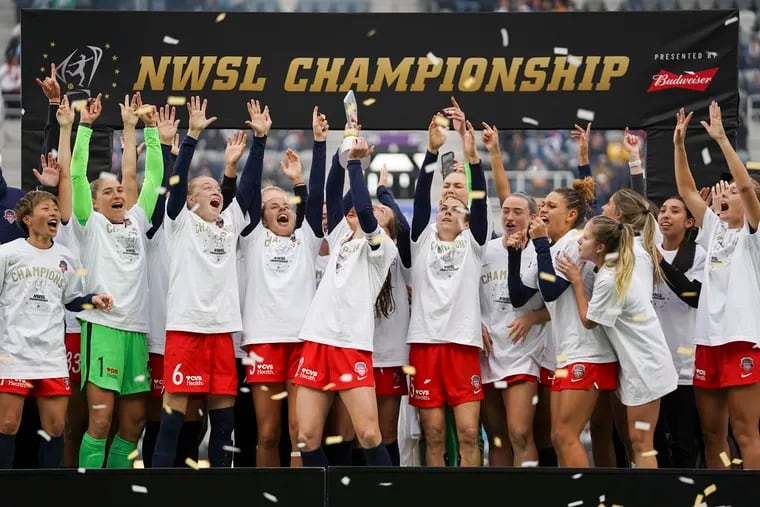 FILE - Washington Spirit players celebrate after defeating Chicago Red Stars in the NWSL Championship soccer match Saturday, Nov. 20, 2021, in Louisville, Kentucky. An independent investigation into the scandals that erupted in the National Women's Soccer League last season found emotional abuse and sexual misconduct were systemic in the sport, impacting multiple teams, coaches and players, according to a report released Monday, Oct. 3, 2022. (AP Photo/Jeff Dean, File)