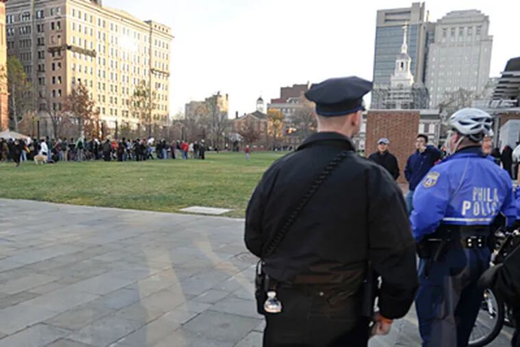 Police keeping a distance from protesters Saturday. While some call last week’s detentions illegal, the department defended its actions. (Ron Tarver / Staff Photographer)