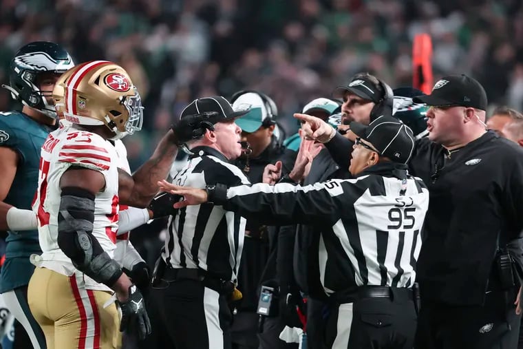 San Francisco 49ers linebacker Dre Greenlaw points at Eagles Chief Security Officer Dom DiSandro in the third quarter on Sunday, December 3, 2023 in Philadelphia.  The two were ejected from the game.
