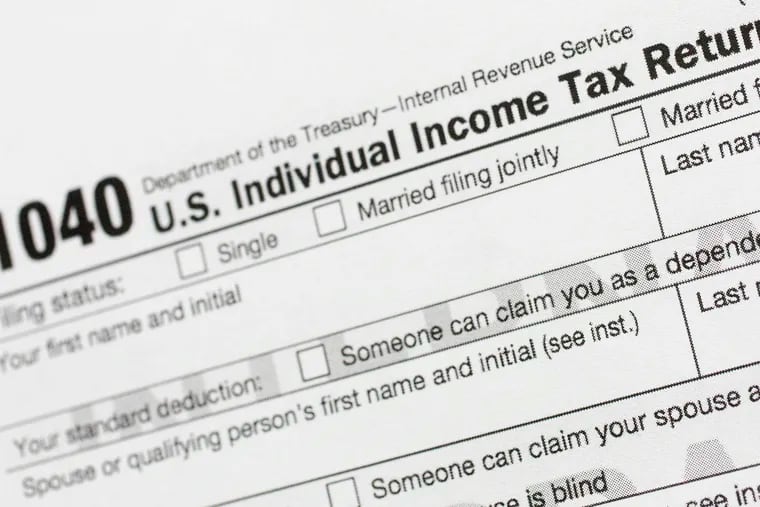 A portion of the 1040 U.S. Individual Income Tax Return form from 2018 is shown.