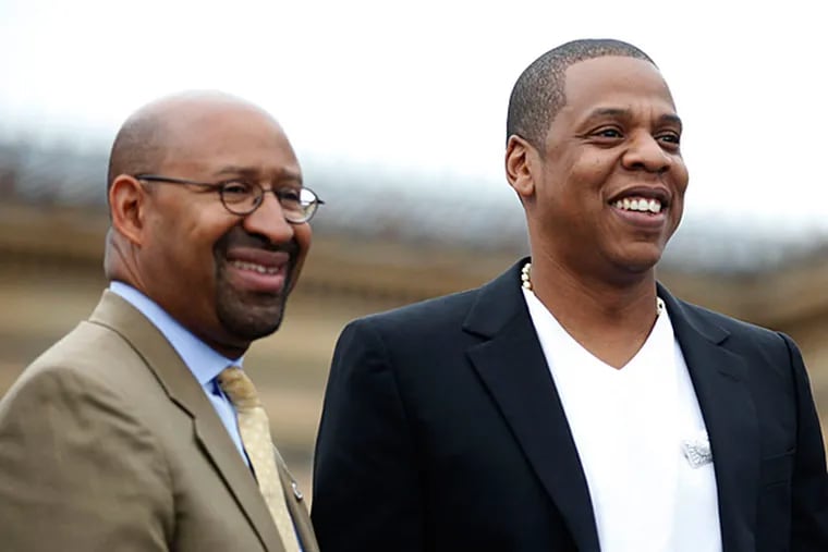 File photo: Jay-Z and Mayor Michael Nutter during a May 2012 press conference on the steps of the Philadelphia Museum of Art. (DAVID SWANSON / Staff Photographer)