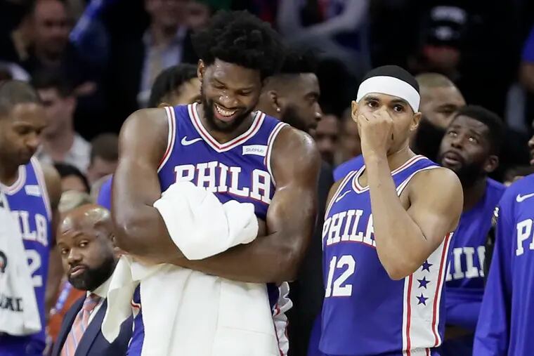 Sixers Joel Embiid and Tobias Harris wait for officials after Embiid was involved in a third quarter altercation with the Timberwolves' Karl-Anthony Towns.