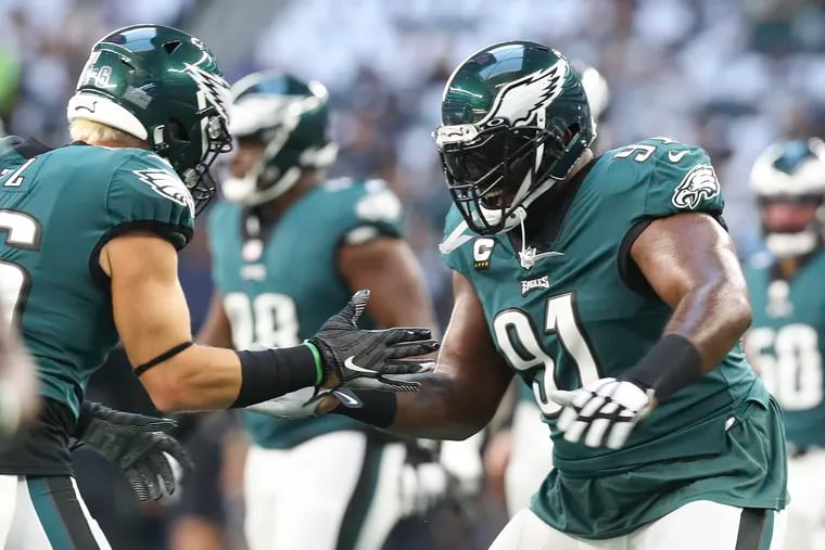 Eagles defensive tackle Fletcher Cox and tight end Zach Ertz dance during warm-ups before the Eagles play the Dallas Cowboys on Monday, September 27, 2021 in Arlington, Texas.
