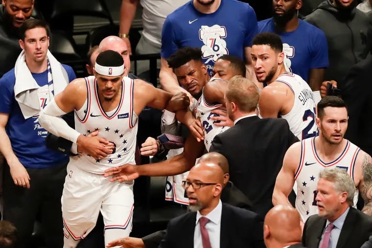 Sixers guard Jimmy Butler gets held back after a shoving match against the Brooklyn Nets in game four of the Eastern Conference playoffs on Saturday, April 20, 2019 in Brooklyn.  Butler was ejected from the game.