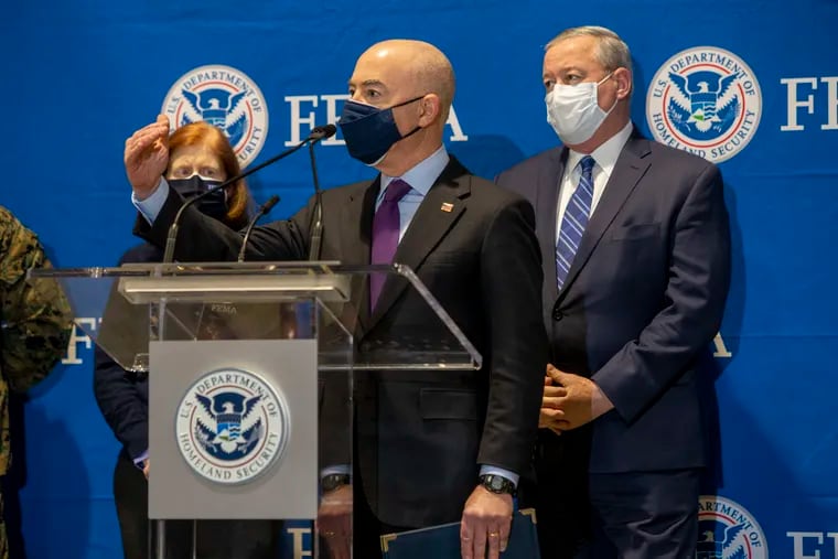 Secretary of Homeland Security Alejandro N. Mayorkas and Philadelphia Mayor Jim Kenney (background) at the Pennsylvania Convention Center. Another FEMA-run site will open in the city.
