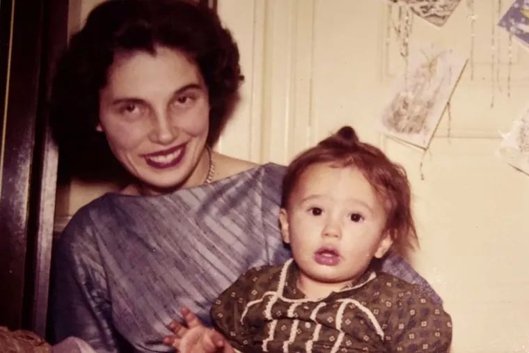 Catherine Laughlin as a toddler with her mother, Carmela. She started searching her mother's history after having her own child.