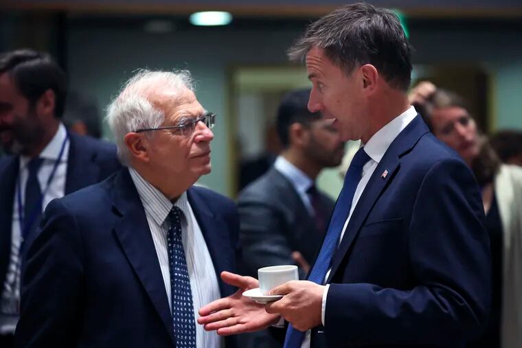 Britain's Foreign Secretary Jeremy Hunt, right, talks to his Spanish counterpart Josep Borrell during a European Foreign Affairs meeting at the European Council headquarters in Brussels, Monday, July 15, 2019. European Union nations were looking to deescalate tensions in the Persian Gulf area on Monday and call on Iran to stick to the 2015 nuclear deal, despite the pullout of the United States from the accord and the re-imposition of U.S. sanctions on Tehran. (AP Photo/Francisco Seco)