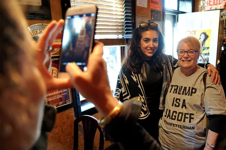Gisele Fetterman, the wife of Senate candidate John Fetterman, poses for a picture with a supporter of her husband.