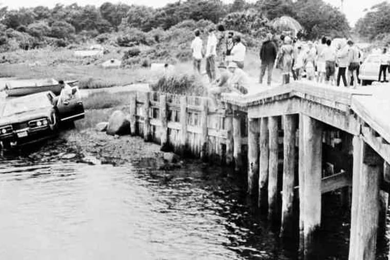 Kennedy's car is pulled from water after fatal accident in July 1969.