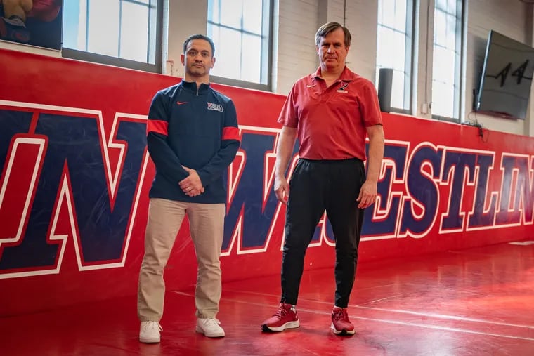 Matt Valenti (left) will take over the Penn wrestling program in 2025-26, when longtime coach Roger Reina will move into an emeritus role for one season before retiring from coaching.