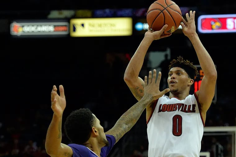 Louisville Cardinals guard Damion Lee (0) shoots against Kentucky Wesleyan Panthers forward C.J. Blackwell (15) during the second half at KFC Yum! Center. Louisville defeated Kentucky Wesleyan 77-68.