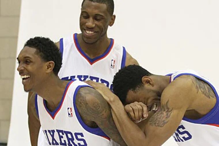 The Sixers' Lou Williams, Thaddeus Young and Andre Iguodala share a laugh during media day. (Charles Fox/Staff Photographer)