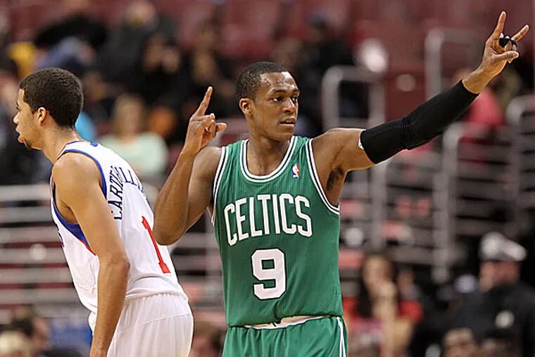 The Celtics' Rajon Rondo signals to his teammates during the third quarter. (Yong Kim/Staff Photographer)