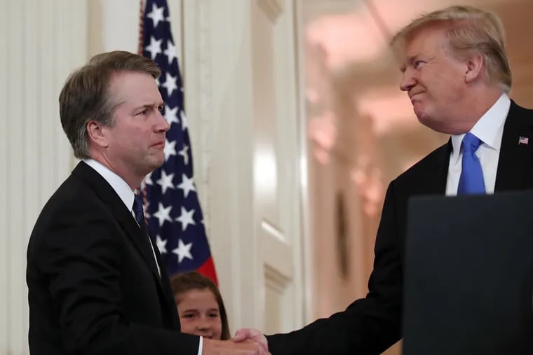 President Donald Trump shakes hands with Judge Brett Kavanaugh his Supreme Court nominee, in the East Room of the White House, Monday, July 9, 2018, in Washington.