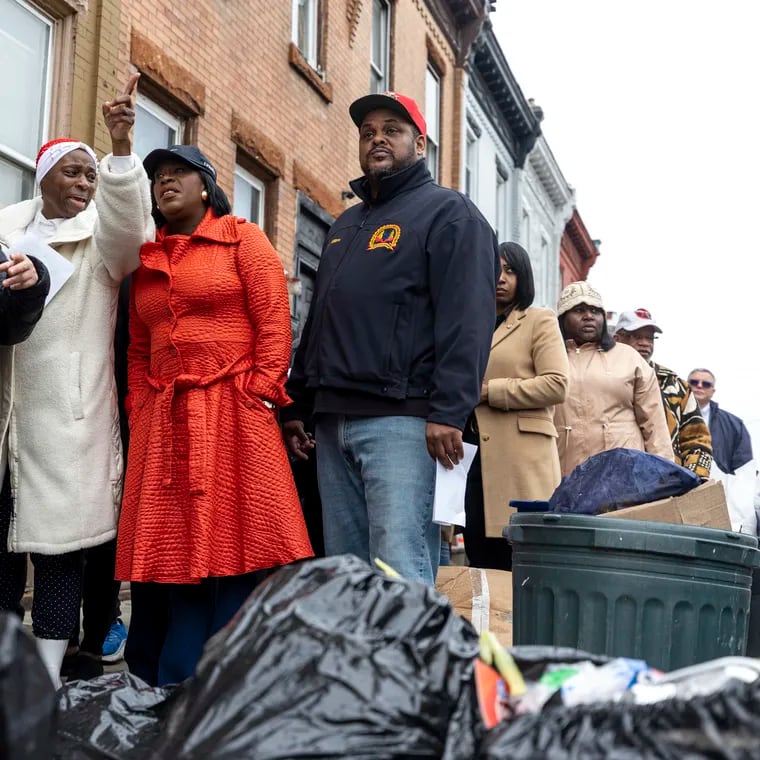 Bonita Cummings, head of Strawberry Mansion Community Concern, points out illegal dumping to Mayor Cherelle L. Parker during a tour of Strawberry Mansion earlier this year. At right is Carlton Williams, Parker's director of clean and green initiatives.