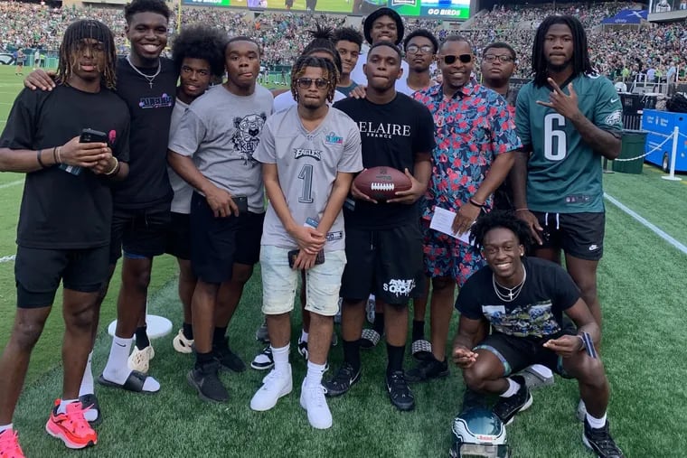 The Achievers, a group of young, college-bound Philadelphia Black men, on the field at an Eagles practice this month.