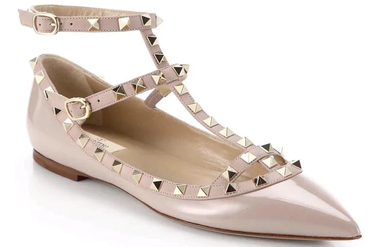 Girly glamour is all the rage in this studded, leather caged flat in nude, $975.