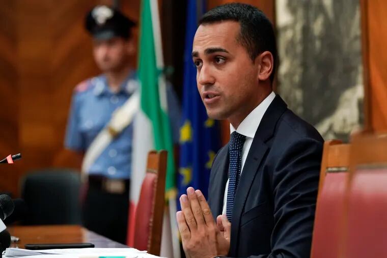 FILE -- In this Aug. 23, 2018 file photo, Italian labor and development minister Luigi Di Maio talks to reporters during a press conference in Rome. The father of Italy's labor and development minister has apologized publicly for hiring workers off the books for his small construction firm but insists his "errors" shouldn't reflect badly on his son.  (AP Photo/Andrew Medichini)