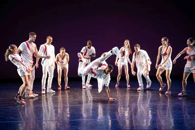 Roderick Phifer is surrounded by his BalletX colleagues (from left) Skyler Lubin, Blake Krapels, Richard Villaverde, Caili Quan, Stanley Glover, Anna Peabody, Zachary Kapeluck, Francesca Forcella, Andrea Yorita in Lil Buck's "Express."