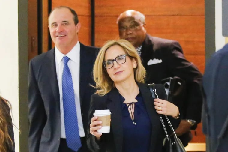 Bill Cosby’s attorney Angela Agrusa (,center) arrives at the Montgomery County Courthouse  in Norristown during the trial in June. On Tuesday, she asked a Montgomery County judge to let her withdraw from the case.