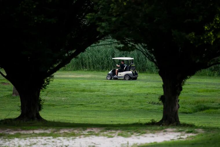 A golfer rides along at the FDR Golf Club on Thursday, July 11, 2019. The course will close in October.