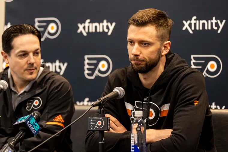 Ivan Fedotov (right), sitting alongside Flyers general manager Danny Brière, speaks to the press Friday about finally coming to Philadelphia.